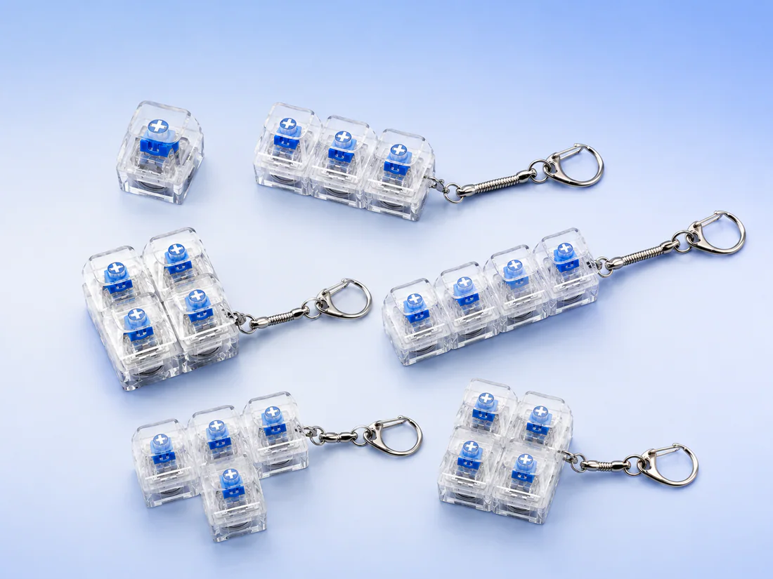 Transparent mechanical switch keychains in several configurations
