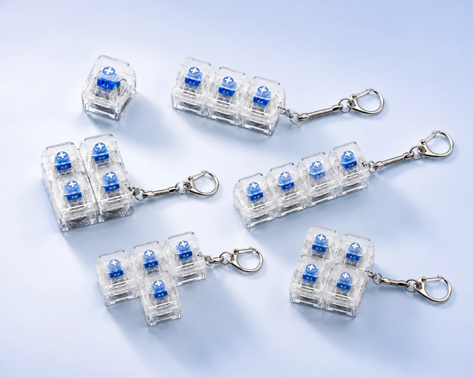 Transparent mechanical switch keychains in several configurations